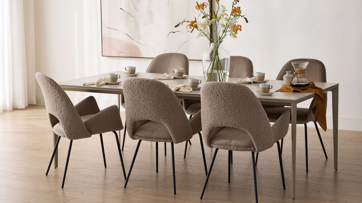 Dolce Dining Chairs in Cool Taupe around a dining table in a bright dining room