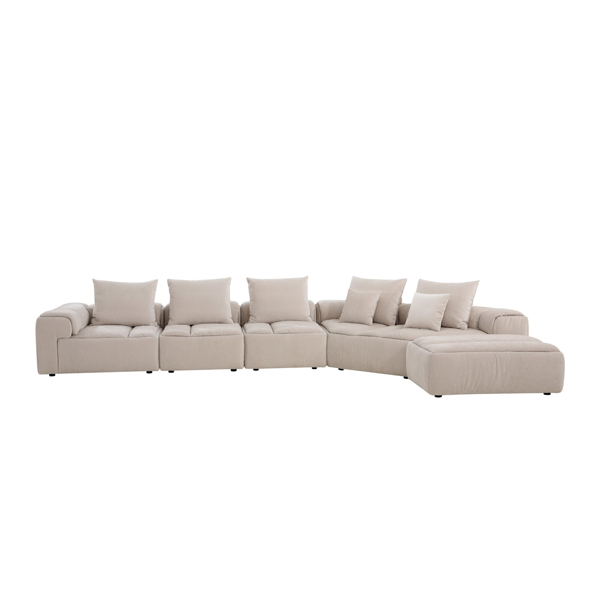 Modani Modular Sectional in beige, wide front view of the complete L-shaped arrangement with the armrest piece on the left, corner module, chaise ottoman extending at the right, and throw pillows, on a white background