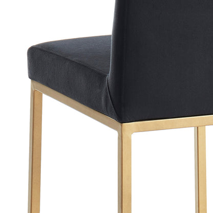 Close-up of Diego 26-inch counter stool showing black velvet seat edge and aged gold metal leg