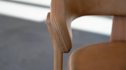 Duke Dining Armchair in Vintage Tan leather with natural oak frame — backrest stitching detail close-up
