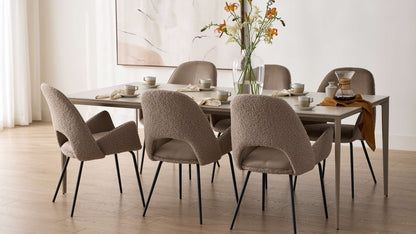 Dolce Dining Chairs in Cool Taupe around a dining table in a bright dining room
