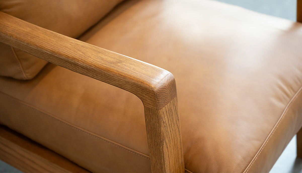 Craftsman Occasional Chair in Butternut Leather and Natural Oak Frame – close-up of armrest and seat leather