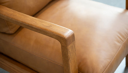 Craftsman Occasional Chair in Butternut Leather and Natural Oak Frame – close-up of armrest and seat leather