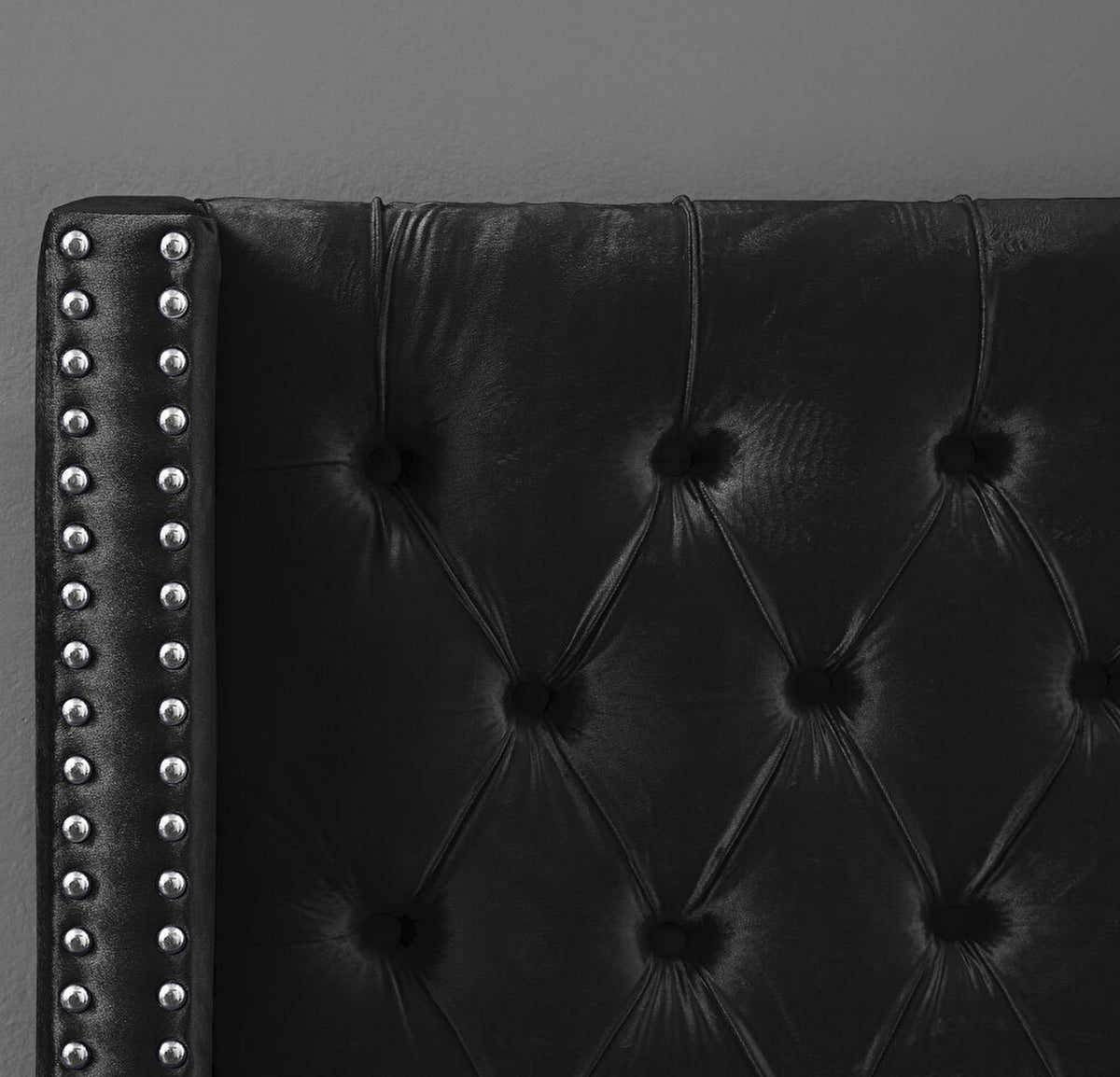 Aiden Black Velvet Upholstered Bed, close-up of diamond tufting and chrome nailheads