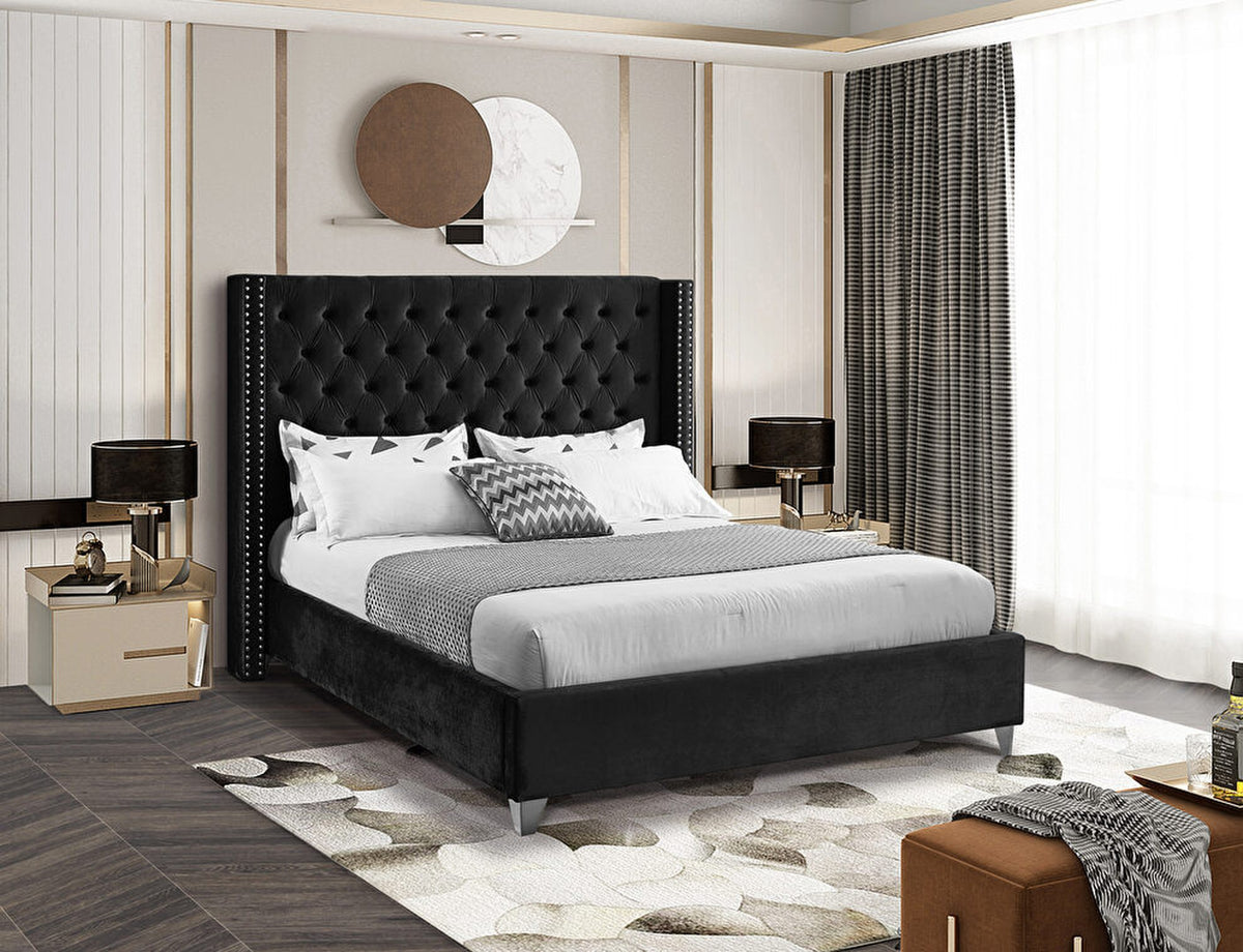 Aiden Black Velvet Upholstered Bed in a styled bedroom