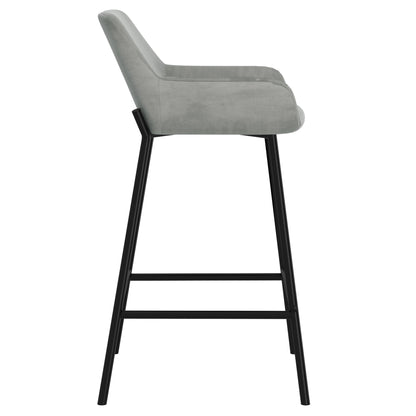 Side profile view of the Baily 26 inch counter stool in grey velvet with black metal legs and footrest