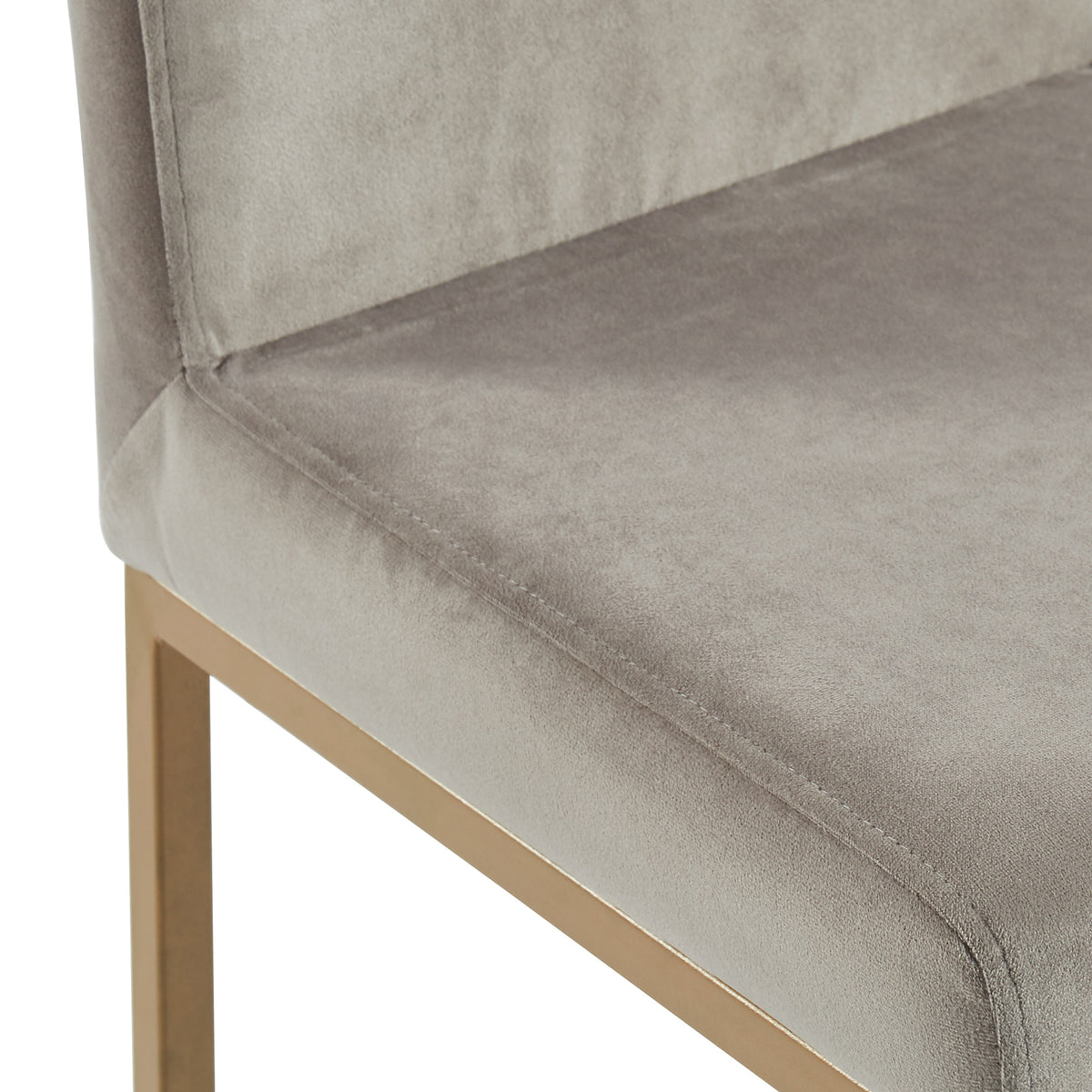 Close-up of the grey velvet upholstered seat corner of the Diego 26-inch counter stool