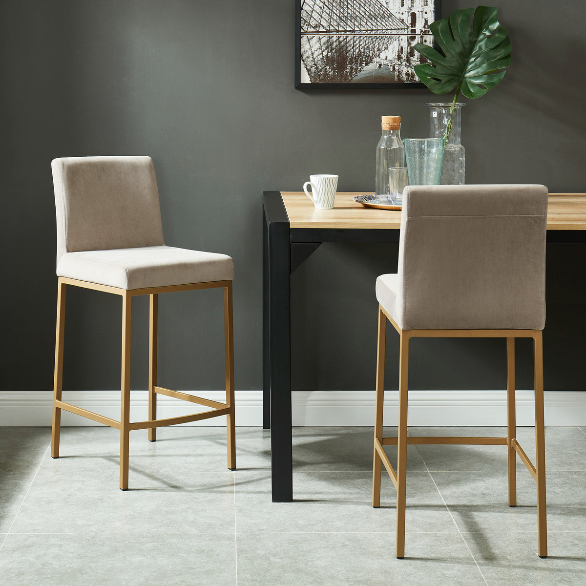 Diego 26-inch counter stool, set of 2, in beige velvet with aged gold legs, styled at a dining table