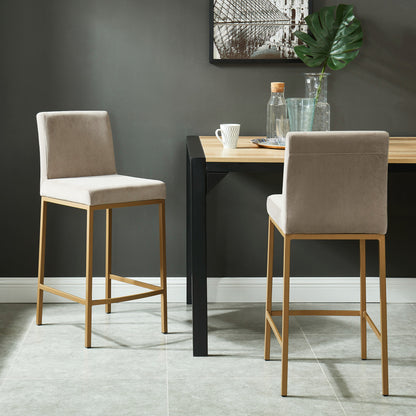 Diego 26-inch counter stool, set of 2, in beige velvet with aged gold legs, styled at a dining table