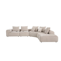 Modani Modular Sectional in beige, angled view of the L-shaped sectional with corner seat and chaise lounge on a white background