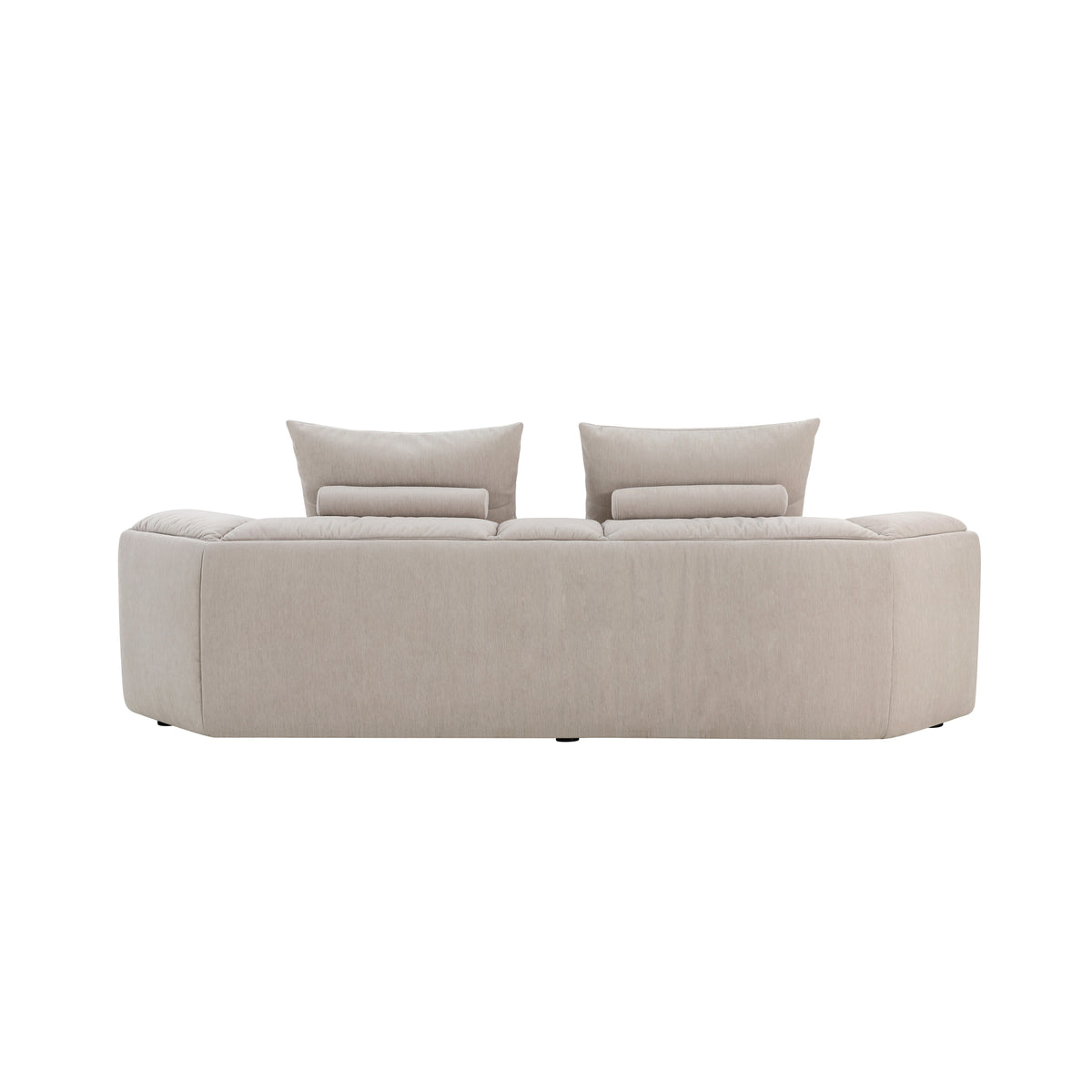 Modani Modular Sectional in beige, rear view of a two-seat module showing the upholstered back with two back cushions and bolster pillows above on a white background