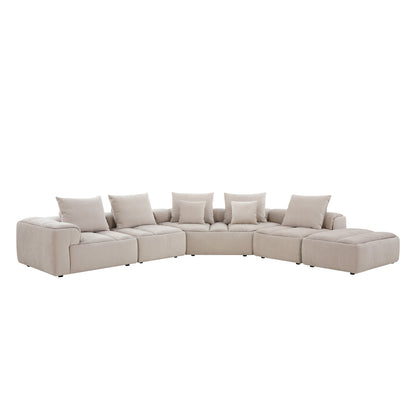 Modani Modular Sectional in beige, front view of the full U-shaped sectional arrangement with back cushions and end ottoman on a white background