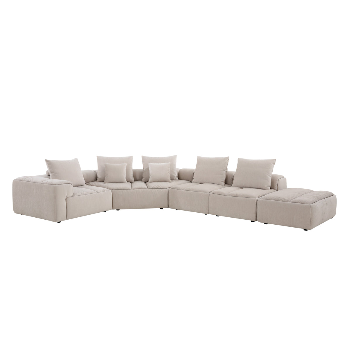 Modani Modular Sectional in beige, front view of the complete sectional with an armrest on the left, deep seat cushions and the ottoman on the right, on a white background